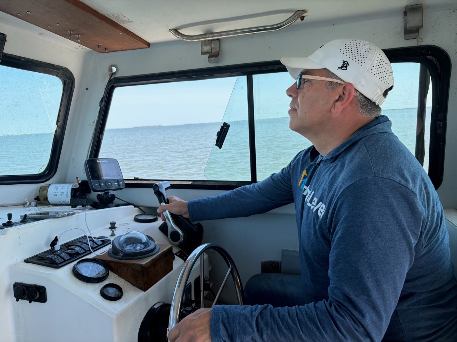 Buddy at the helm of a boat